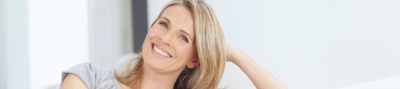 Blonde woman happy with her dental veneers
